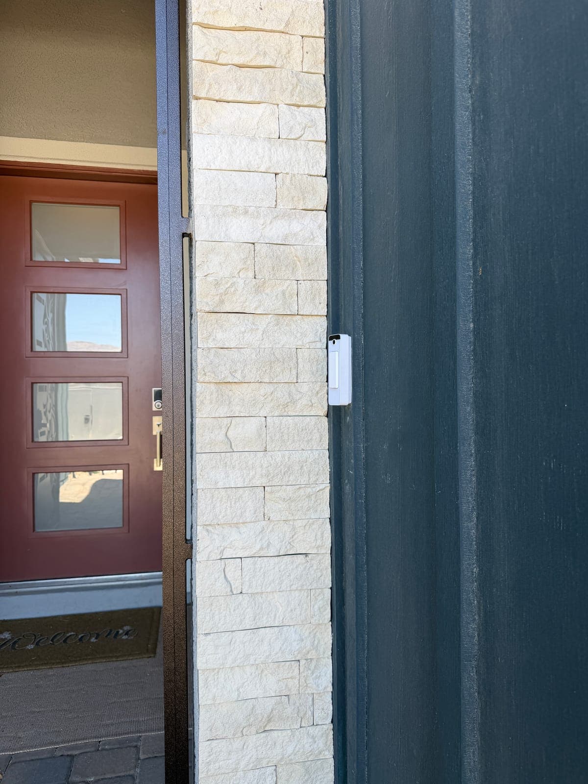 UniFi video doorbell at the front entry, wired in and tied to the camera system.